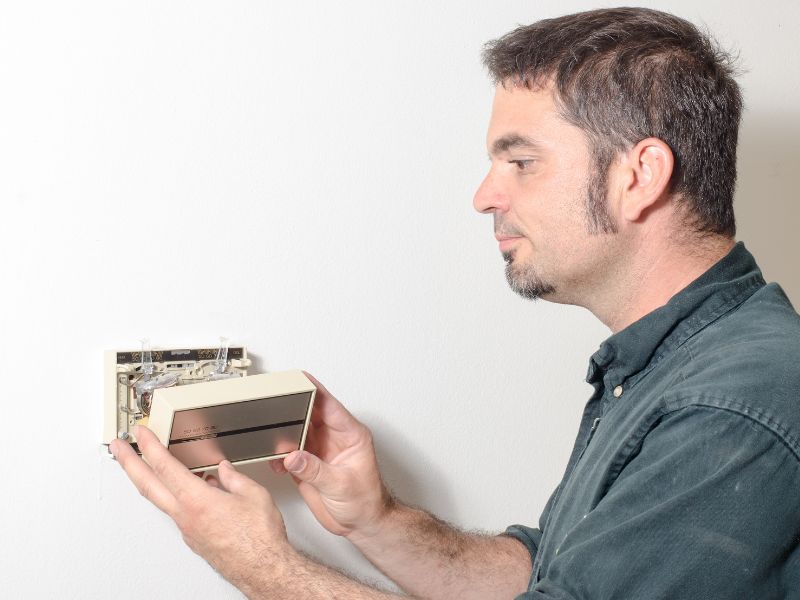 how to remove thermostat cover